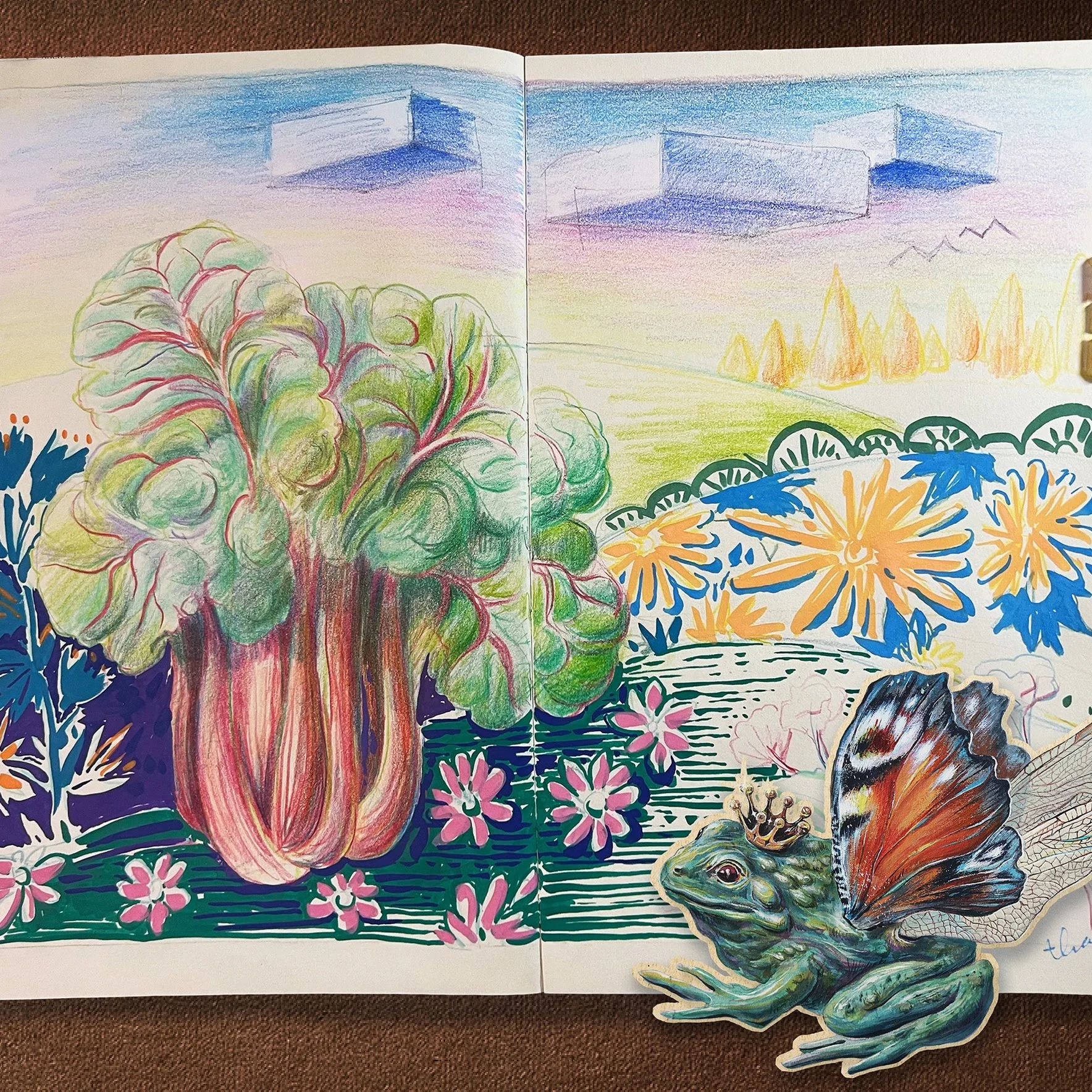 Open sketchbook with colorful imaginative nature study
